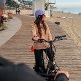 aventon-sinch-2.5-small-step-thru-ebike-cyclist-on-boardwalk